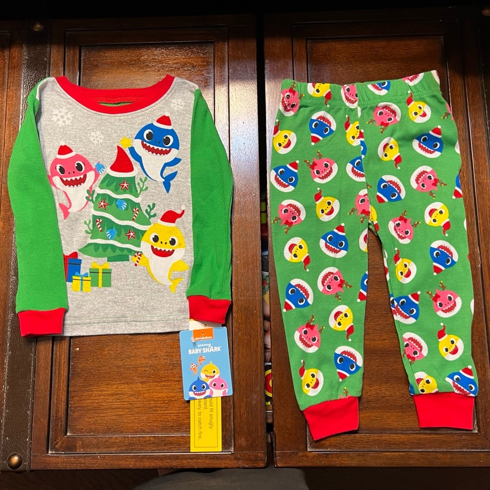 NWT Baby Shark Pajama These are new with no stainss. Comes from smoke free home.
